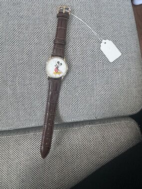 Disney's Mickie Mouse Brown Leather Watch with Character on the Dial.
